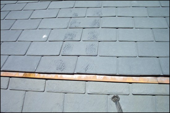 The top surface of some brands tends to oxidize. Here, workers had rubbed off the top oxidized layer with their shoes when maintaining a skylight on an upper roof. These wear marks can be quite noticeable from the ground.