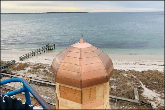 With the copper panels capped with an octagon-shaped apron and soldered finial, the roof of the "Salt Shaker" is ready for another 100 years of duty.
