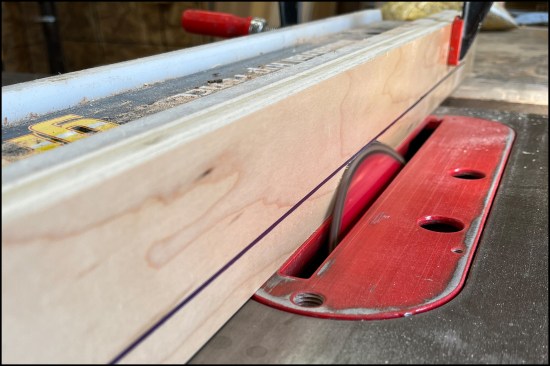 To bevel the tapered edges, the author raises the table-saw blade at 22 1/2 degrees into a sacrificial fence face, at the thickness of the stock.