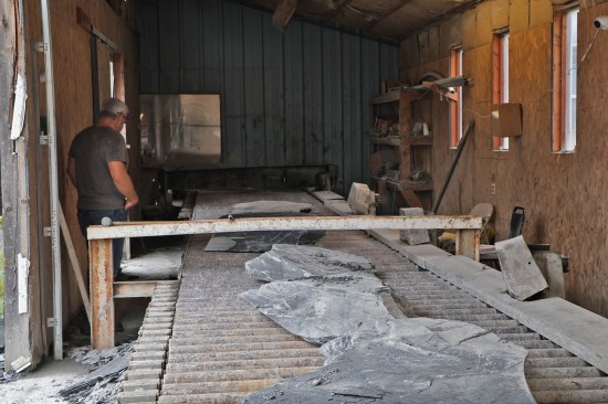 The split blocks are loaded onto a conveyor leading to the cutting rooms.