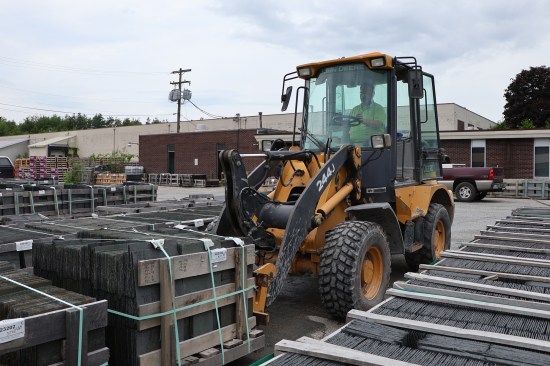 Forklifts are used to ferry orders awaiting delivery and the acres inventory around the slate yard. Pricing for a square roof slate ranges widely due to color selection and thicknesses. The least expensive slate is roughly $400 a square, while the most expensive goes for over $2,000 a square.
