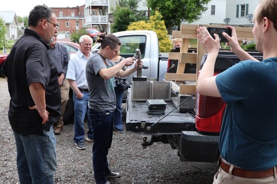 Shawn Camara of Camara Slate Products, Inc. (left, foreground) shows the public how to hand split slate during a “Slater Day” event at the Slate Valley Museum in June of 2023. Photo by Tim Healey
