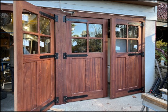 With the doors hung and finished with a sealer, the panes of 1/4-inch tempered glass were installed and set in a small bead of silicone sealant.