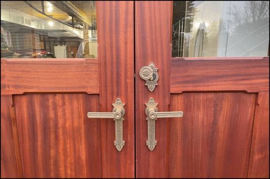 The finish door locking hardware and chamfered bevel cut run 2 inches shy of the corners of the rails and stiles.