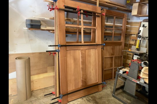 The assembly is transferred from the work table and stood off to the side to dry.