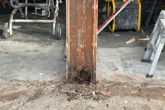 The bottom of the center support framing was badly rotted (the center “wall” picked up one end of a steel girder running through the middle of the structure which supported the second-floor).