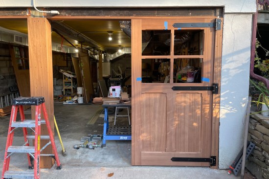 The hinge leaves were attached to the rebuilt framed openings with galvanized lag bolts.