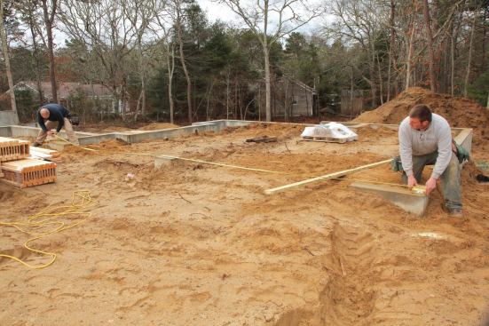 Then, making the assumption that the foundation contractor had gotten the dimensions correct, we did the same with the front wall of the garage and marked the opposite corner.