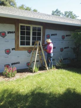 Flashing tape was installed around the rest of the window. Because the house's 2-foot roof overhangs go a long way toward protecting these windows from moisture intrusion, no supplemental drip cap was added over the windows. 