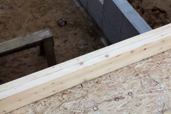 After the openings are laid out, the rough opening measurements are written on the plates in the opening to help facilitate wall building later.