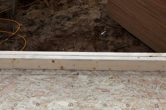 Then, the king and jack studs for either side of the opening are laid out. This house was being framed in a high-wind area, so many of the framing members were doubled or tripled depending on the width of the rough opening.