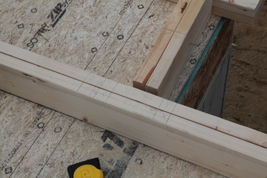 The next things to be laid out are the partition backers, where intersecting walls are attached. For 2x4 walls, the backer is drawn as a stud with another line 5 1/2 inches away. For the 2x6 wall backer shown here, the framing is drawn as two studs 5 1/2 inches apart.