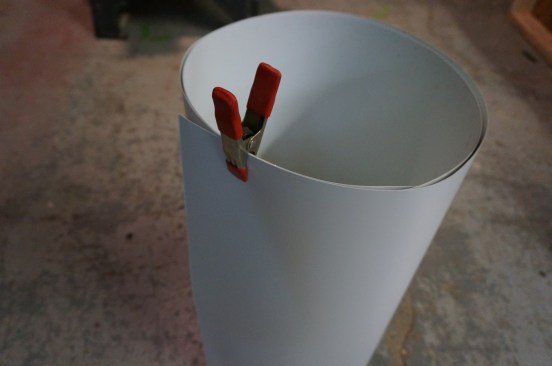 Spring clamps help to keep rolls of aluminum stock under control.
