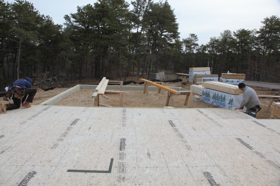 Using the gauge block, measure and mark the distance from the baseline (on the left) to the parallel wall. Working off the edge of the deck, mark an approximate corner with the gauge block.