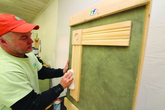 Then he wipes down all surfaces with a damp rag to remove any residue that the vacuum missed.