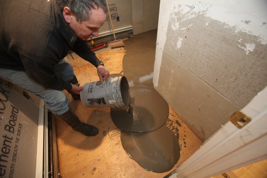 The author pours another batch to fill the low spot in front to of the door.