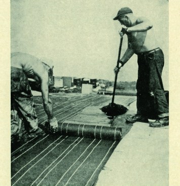 A tar-and gravel crew installing a pitch roof. There were three main guys on an install crew: a mop man, a paper setter, and a kettle man. The mop man ran the roof and skillfully glided the mop (pitch mops were twice as heavy as asphalt mops); the paper setter followed his lead; and the kettle man arrived on site early to start the kettle and kept it full during the day. Apprentices lugged the “hot” from the kettle to the carts.