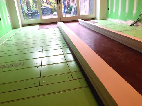 Engineered wood flooring acclimates in preparation for installation.