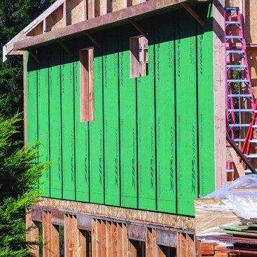 One advantage to OSB is the availability of lengths over 8 feet. Here (above), 4x10 sheets vastly simplify the shear wall on side walls.