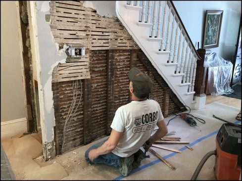 Fighting for every square inch of interior space, the original builders framed the separation studwall “on the flat” to thin out the wall, a typical strategy in Hoboken row-house partitions.