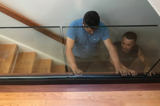 Factory-finished aluminum cladding is installed over the solid aluminum U-channel.