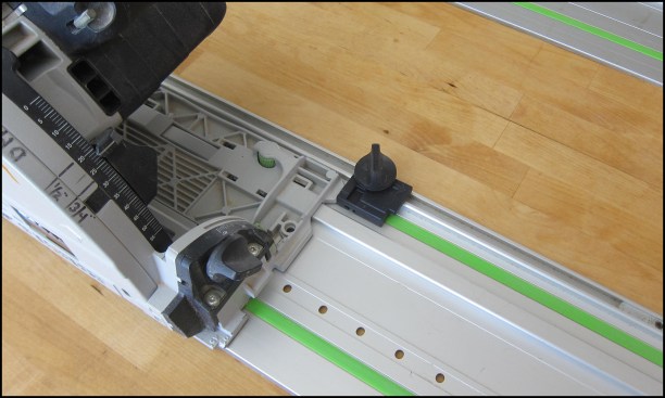 This limit stop slides and clamps onto the rail at any selected position, preventing accidental advancement of the cut.