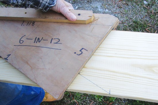 The long edge of the rafter jig is used to mark the level cut, which for this rafter is 4 1/2 inches long. The short edge of the rafter jig …