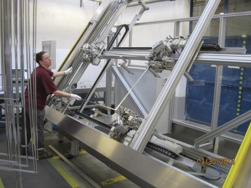 Aluminum spacer frames that separate the panes of glass are pre-cut, assembled, and then the corners are welded.