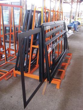 Aluminum cladding comes to the factory in a package for the frames in each project. Attaching it is the final step in the window assembly process.