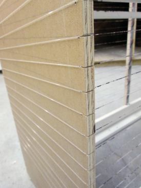 Before assembling the rack, I laid out the spacing for the line at 1-inch intervals along both edges of one side panel, and transferred the layout to the second panel, as well as to the center support strips. At each layout location, I cut a 1/4-inch-deep kerf with my Japanese hand saw to hold the line (1). When all the parts were ready, I screwed the rack together using deck screws. I held the spreaders about 1/2inch in from the edges of the side panels so they wouldn't interfere with the fishing line.