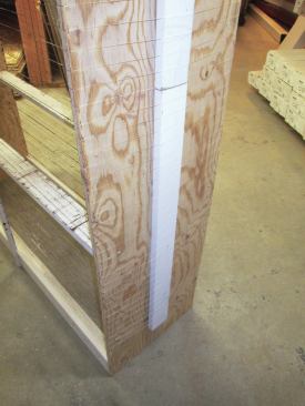 The screw also gave me a place where I could adjust the tension in the line. After I'd strung the entire rack, though, I found the line needed to be tighter, so a friend helped me slide a 1x4 board behind the line along one of the sides, which gave me the extra tension I needed.