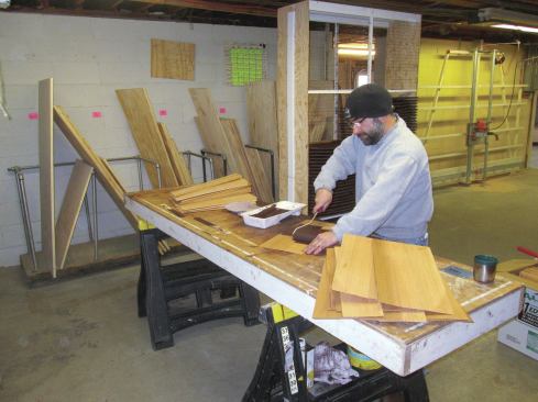 Once the rack was assembled, I was ready to stain the shingles. I set up my work table next to the rack (4). Using a roller—the fastest way to apply the stain—I coated all the sides and edges of each shingle.
