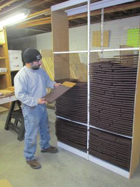 I loaded the rack from the bottom up so I could see the fishing line as I slipped the shingles in. The rack held three boxes of shingles or about one square, which I could stain in a couple of hours.