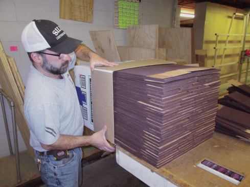 Once a stack was tall enough to fill a box, I slid the pile into one and taped it closed.