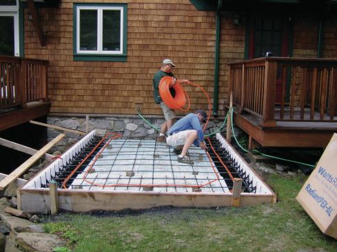 We installed radiant-heat tubing that was connected to a separate zone on the boiler just before the pour.