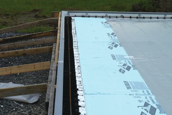 We laid 10-mil Viper VaporCheck) on top of the foam and taped the seams to control moisture migration into the building.