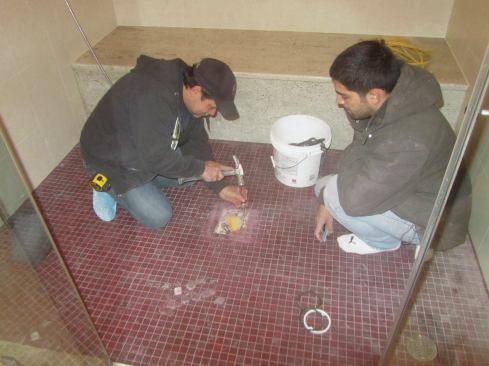 Our hope was that we could fix the problem that way without tearing out the whole shower. We could always come back and take out more if need be. So GLB carefully cut the grout and removed the individual tiles, saving every one, then carefully chipped out the mortar.