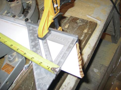 To measure from the short point of a cut, I clamp a Speed Square across the piece and  hook the tape over the square.