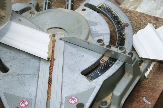 For inside corners, the long point of the miter cut is always at the bottom, and the short point of the bevel cut is always at the front face of the molding.