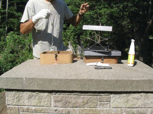 Before feeding the control cable down the flue liner, remove the old throat damper. If the flue liner is not a straight run to the smoke shelf, tie a weight to the end of the cable to help lead it down to the firebox.