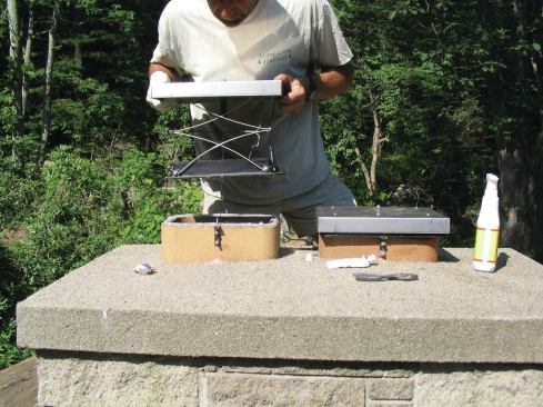 Bed the damper frame and bolt it to the angle brackets.