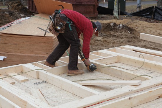 Cripples are first nailed to the bottom plate and then to the sill with the transferred layouts. A second sill nails in on top of the first one to complete the window rough opening.