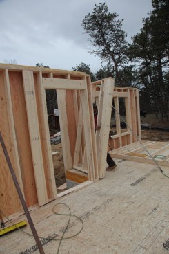Small walls can be framed without sheathing, so they are much lighter. One person can build these walls in nearby free space on the deck and then slide the wall over to its position.