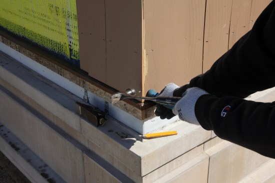 When you're happy with the edge, drive a trim-head stainless steel nail to secure the corner joint. Note that the author adds a second staple on the edge near the corner. This fastener helps to stabilize the corner edges to keep the corner seam from opening up.
