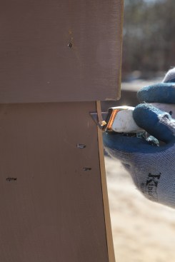 To finish the top edge that the block plane can't reach, carefully slice the material back with a razor knife.