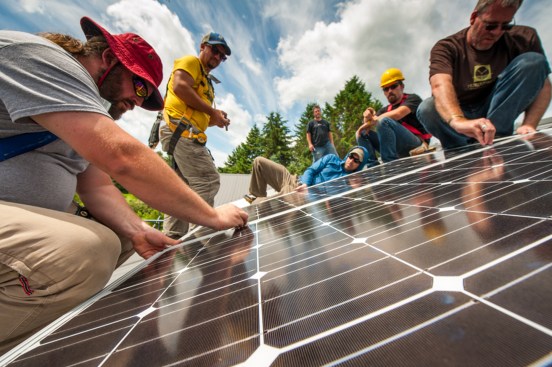 Students from Yestermorrow School learn how to install rooftop solar panels