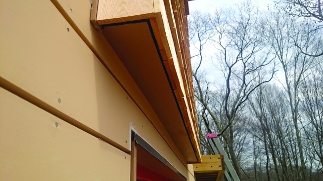 The mesh extends to the bottom of the rainscreen to provide a measure of ventilation for the siding, as well.