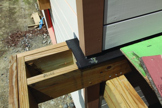 At the deck ledger at the bottom of the wall, flashing channels away any water from the drainage plane of the wall.
