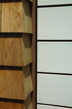 The sidingā1x6 boards painted on all four sidesāis installed with a 3/16-inch gap between the boards and all adjacent material. The gaps provide ventilation for the back of the siding.