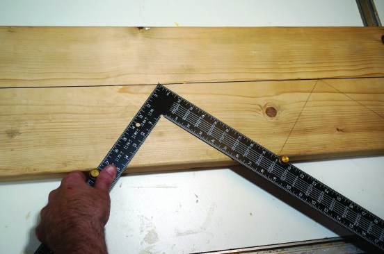 Then lay out the stringer by aligning the heel of the framing square with each of the measurement marks.